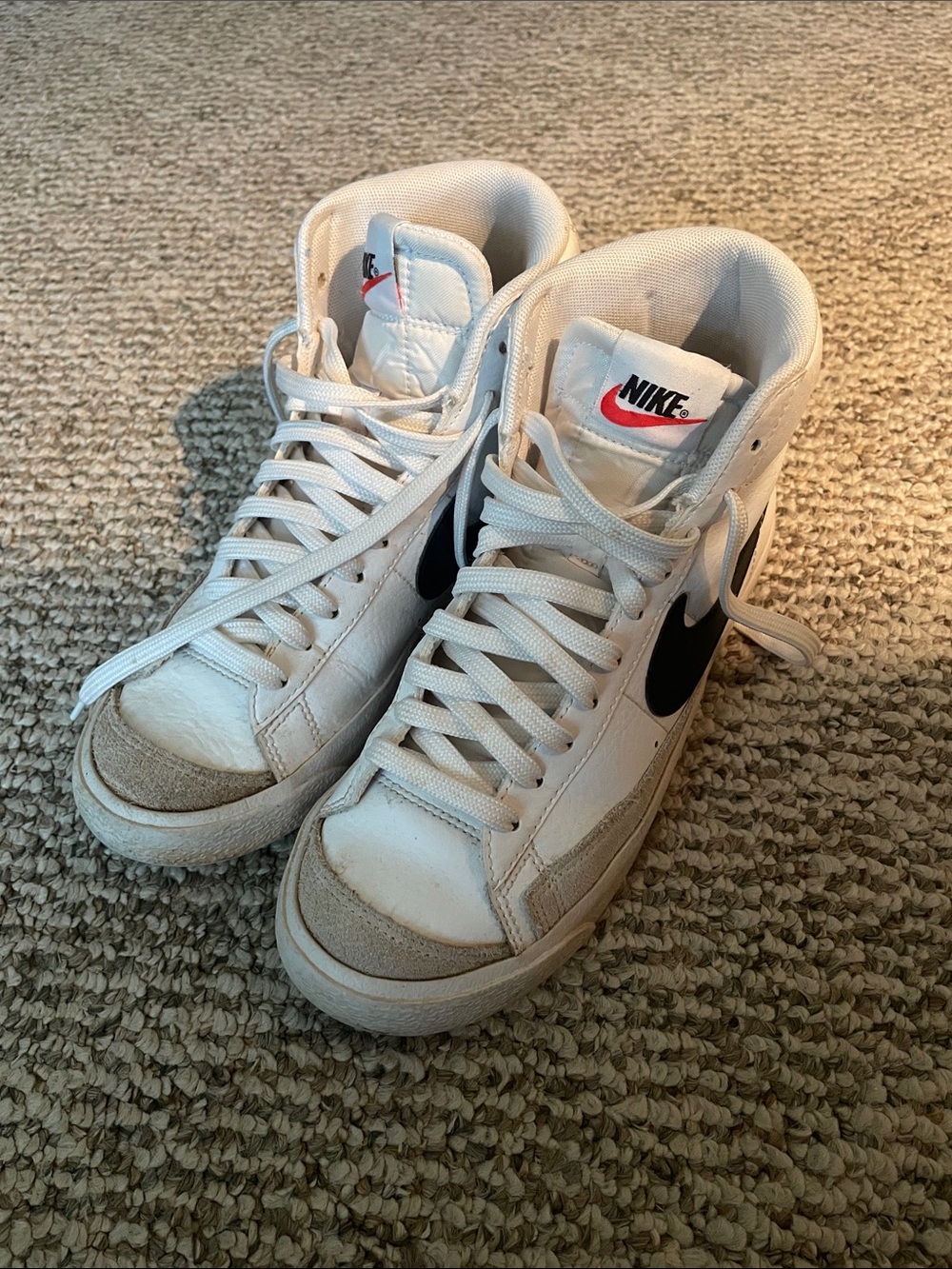 Nike White High-Top Sneakers with Black Swoosh and Red Logo